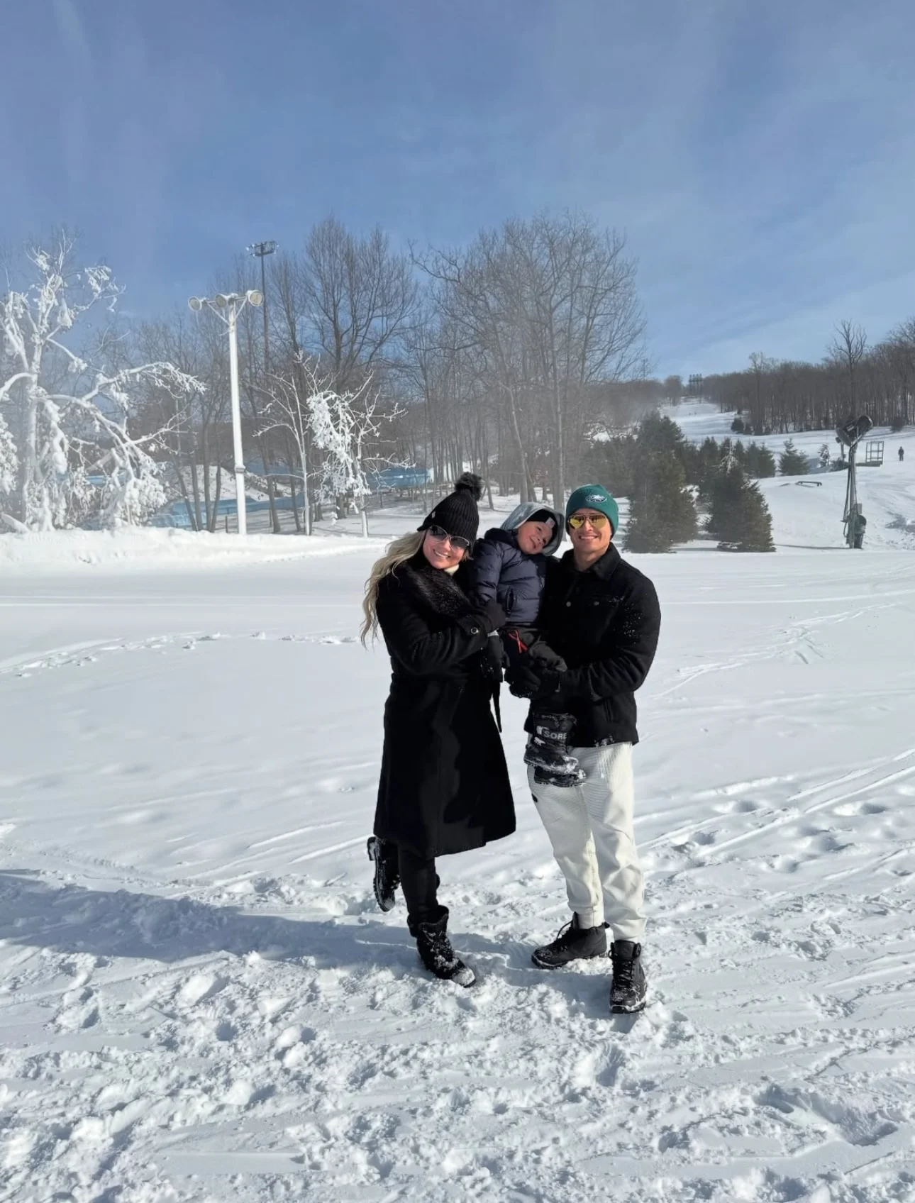 family at standing outside in winter