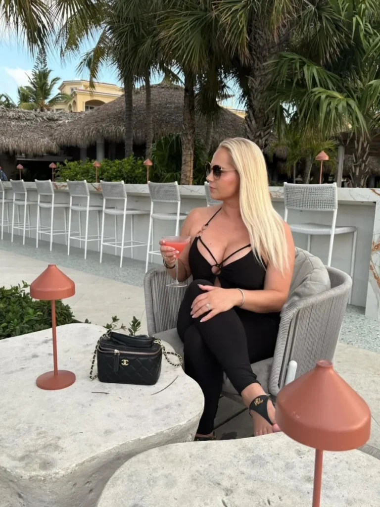 Woman drinking a cocktail at a resort in Turks and Caicos